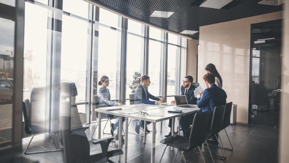 Group of people around a table in office