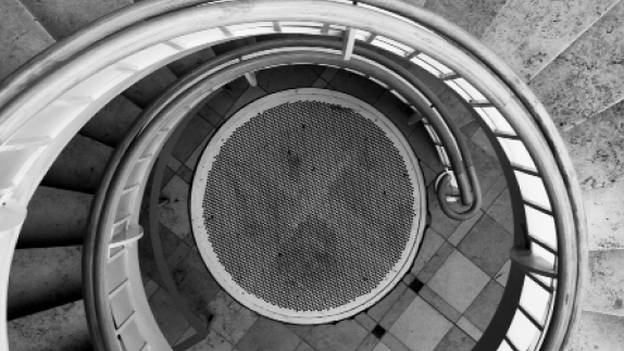 Looking from the top down the center of a spiral staircase