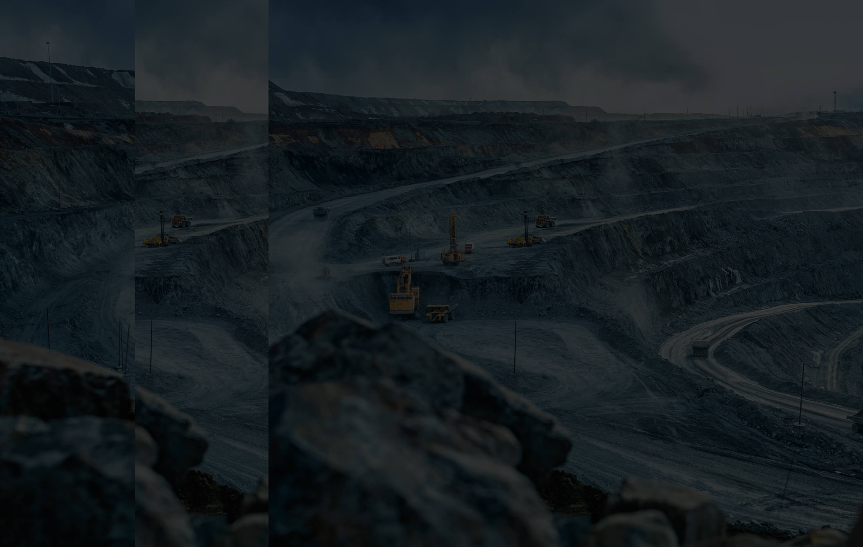 Mining pit with heavy machinery extracting minerals