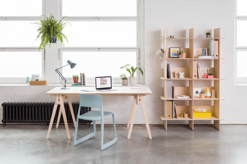 Photo of an office with desk, chair and shelving unit