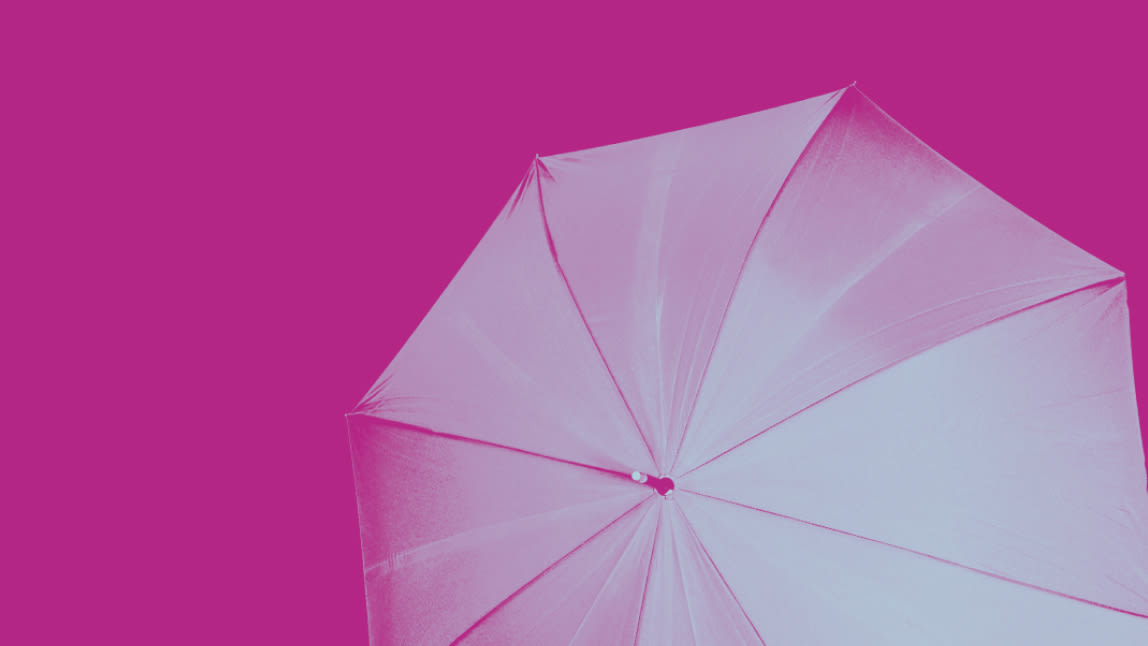 Umbrella on pink background