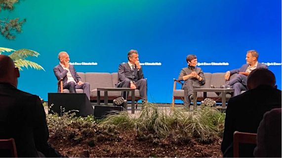 People talking on stage in front of audience