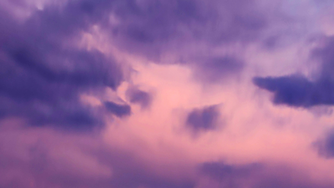 Image of purple-tinged clouds. 