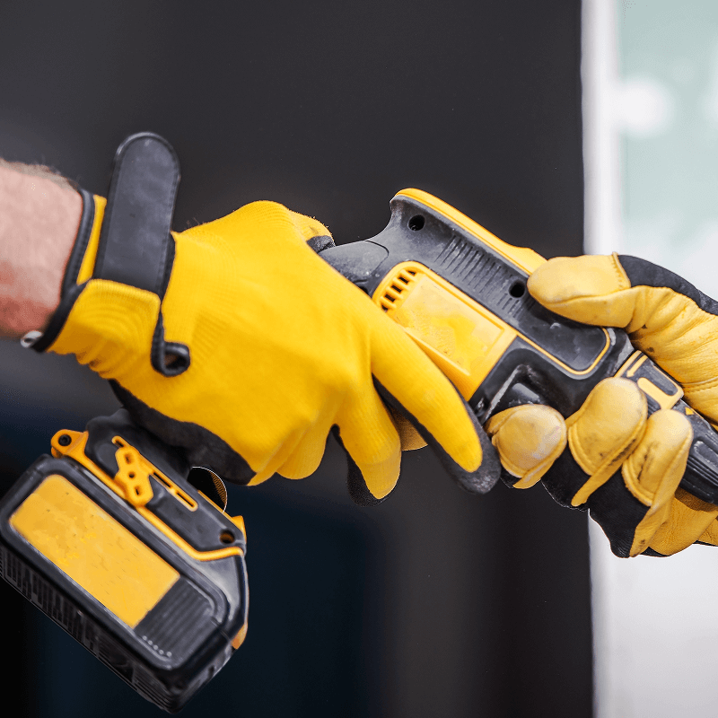 A person using a power drill