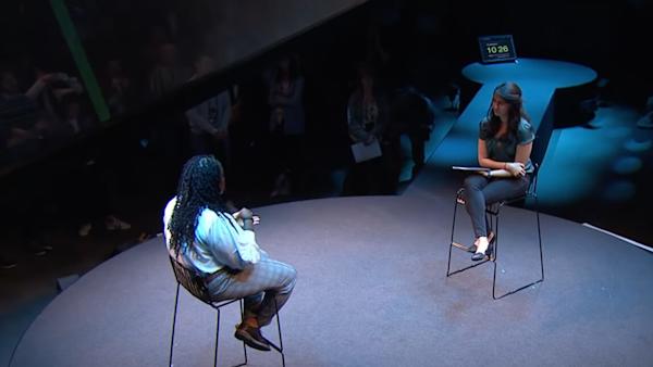 people speaking on stage