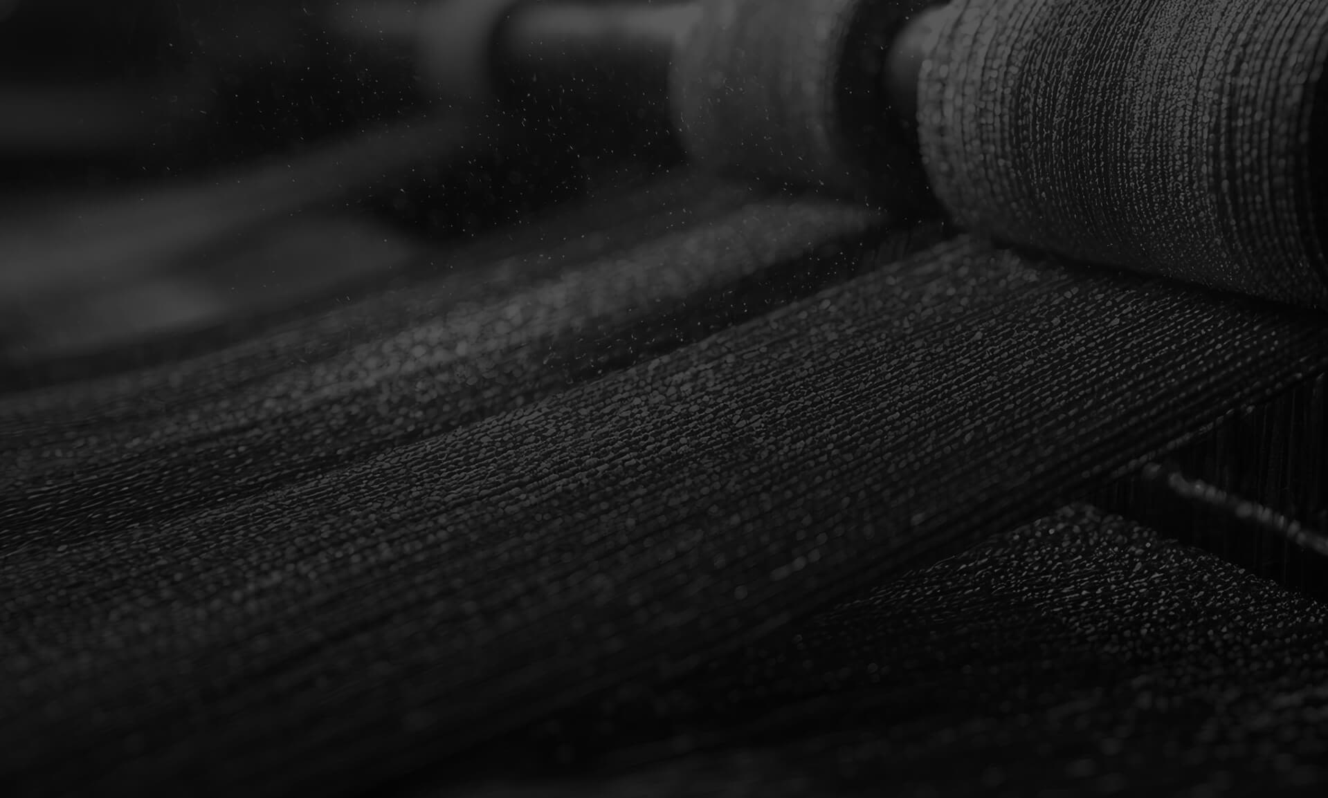 Cotton being woven on a machine