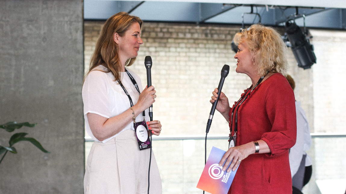 Two people talking with microphones