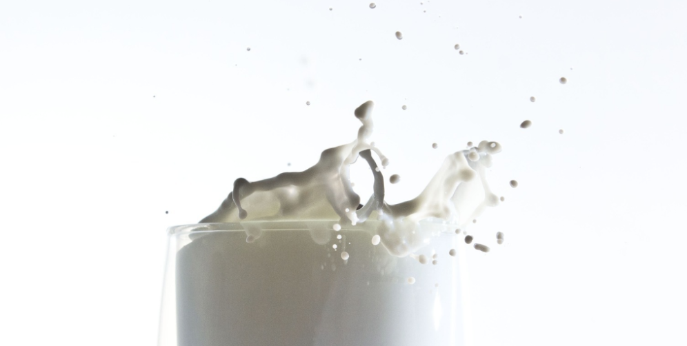 Macro close up of milk splash in glass