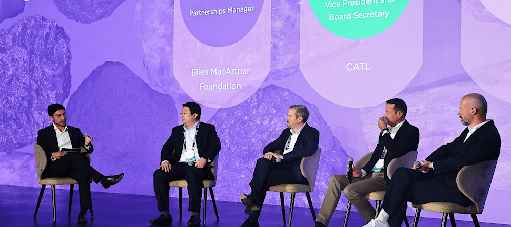 People on a stage discussing a topic