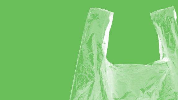 Plastic bag on green background