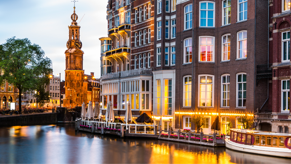 Amsterdam cityscape with the Mint tower at dusk.