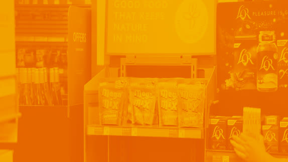 Food products on shelf with orange overlay