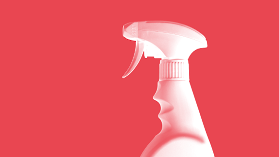 Spray bottle on red background