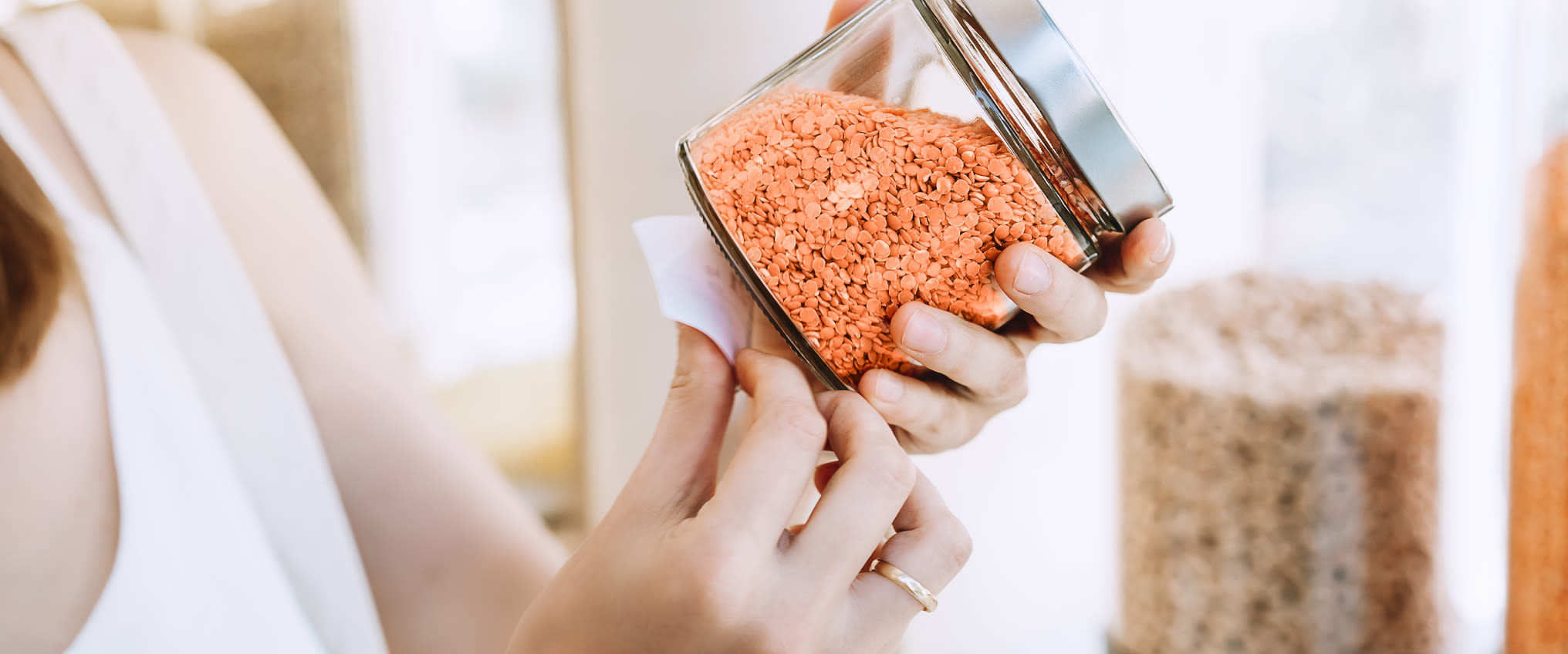 Person holding jar of grains