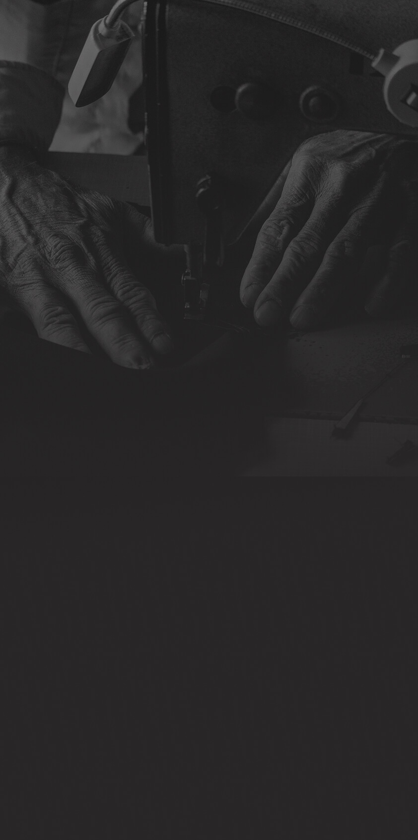 Person mending clothes on a sewing machine