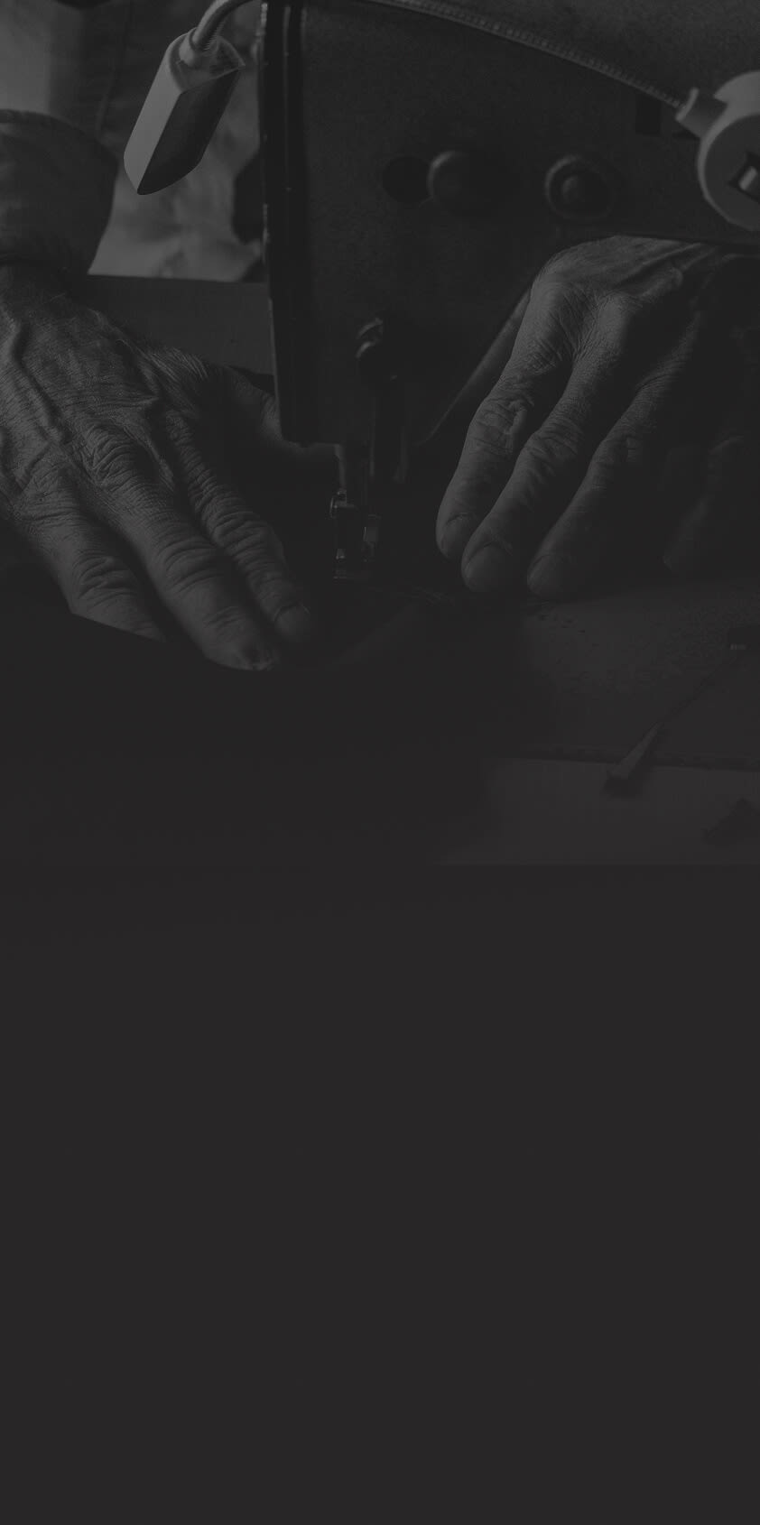 Person mending clothes on a sewing machine