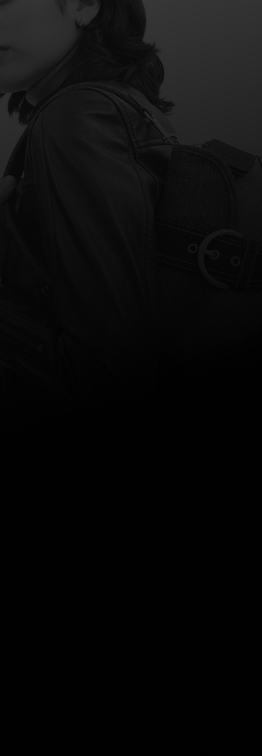 Person carrying a handbag over their shoulder