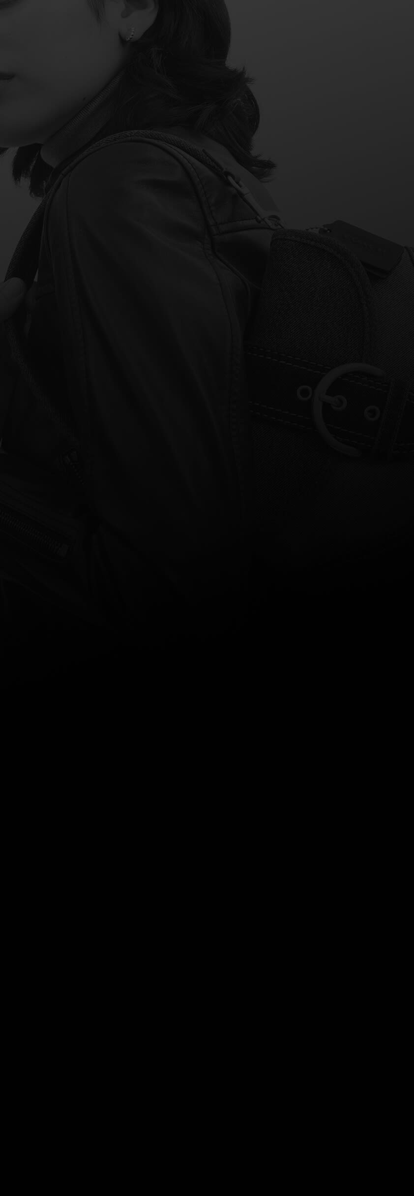 Person carrying a handbag over their shoulder