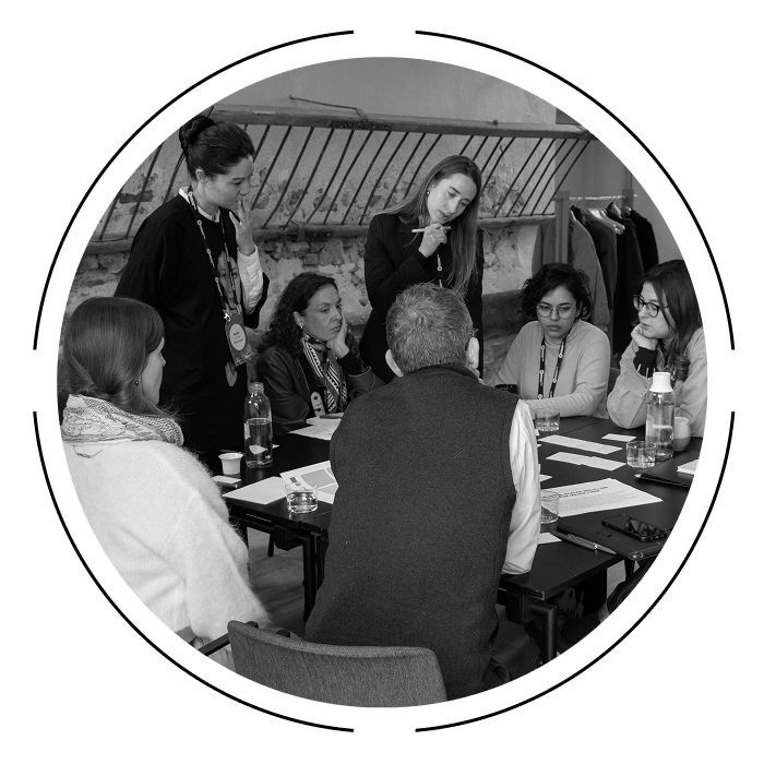 People talking at a fashion workshop