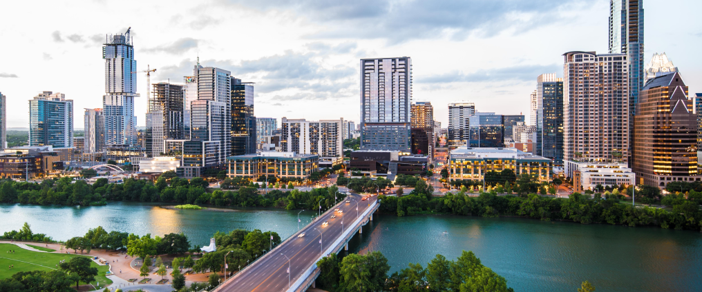 Masthead image of circular example for Austin showing the city, bridge, and river