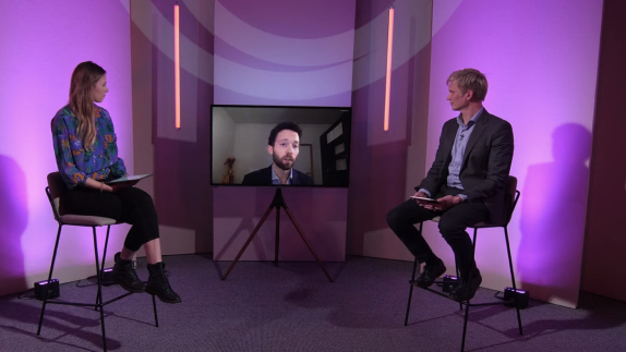 show host talking to guest