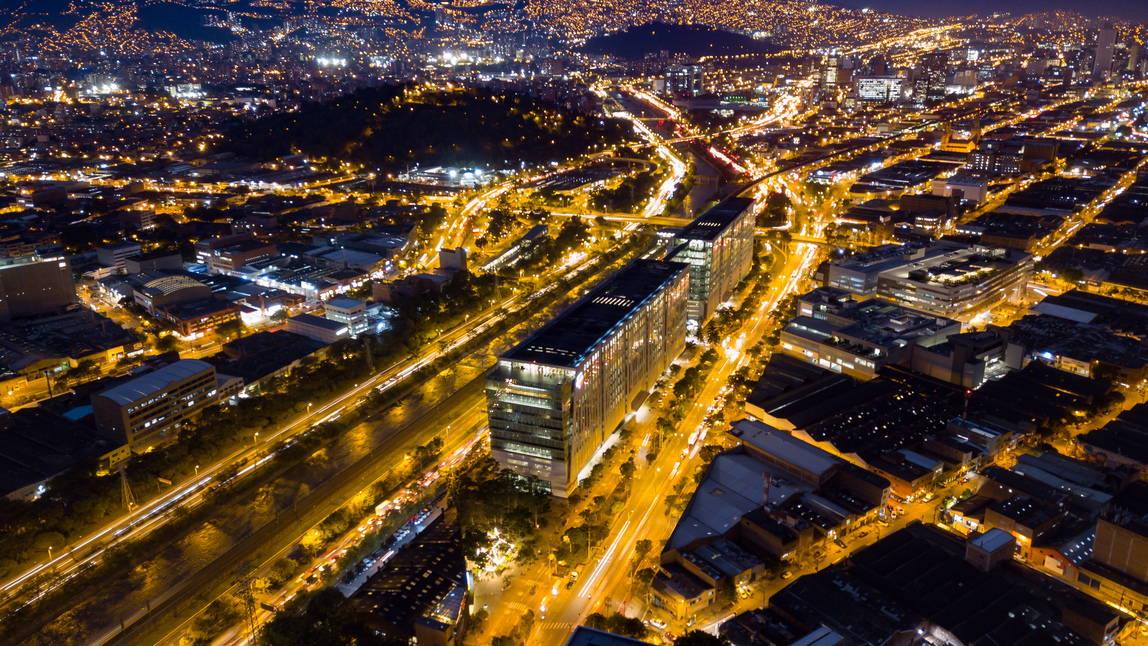 An image of the Bancolombia Building at night. 