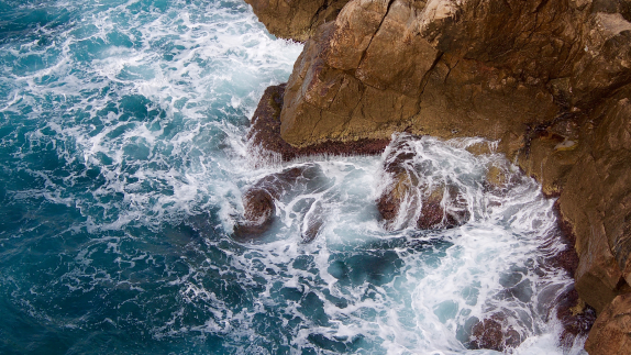 waves crashing onto rocks