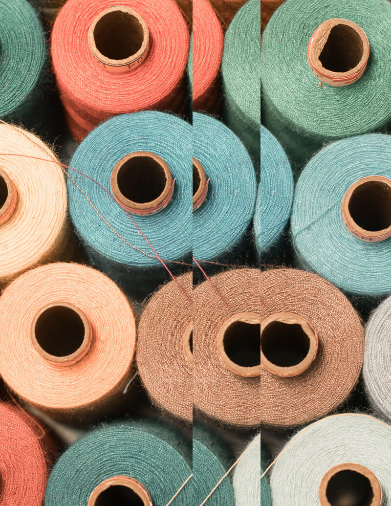 cotton reels with different colours of cotton