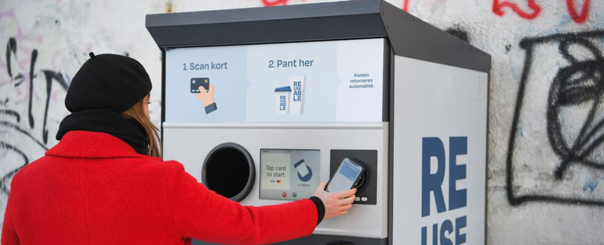 Image of someone using a card machine. 