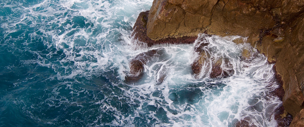waves crashing onto rocks