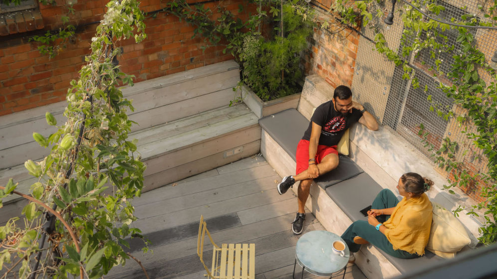 People talking on a bench 