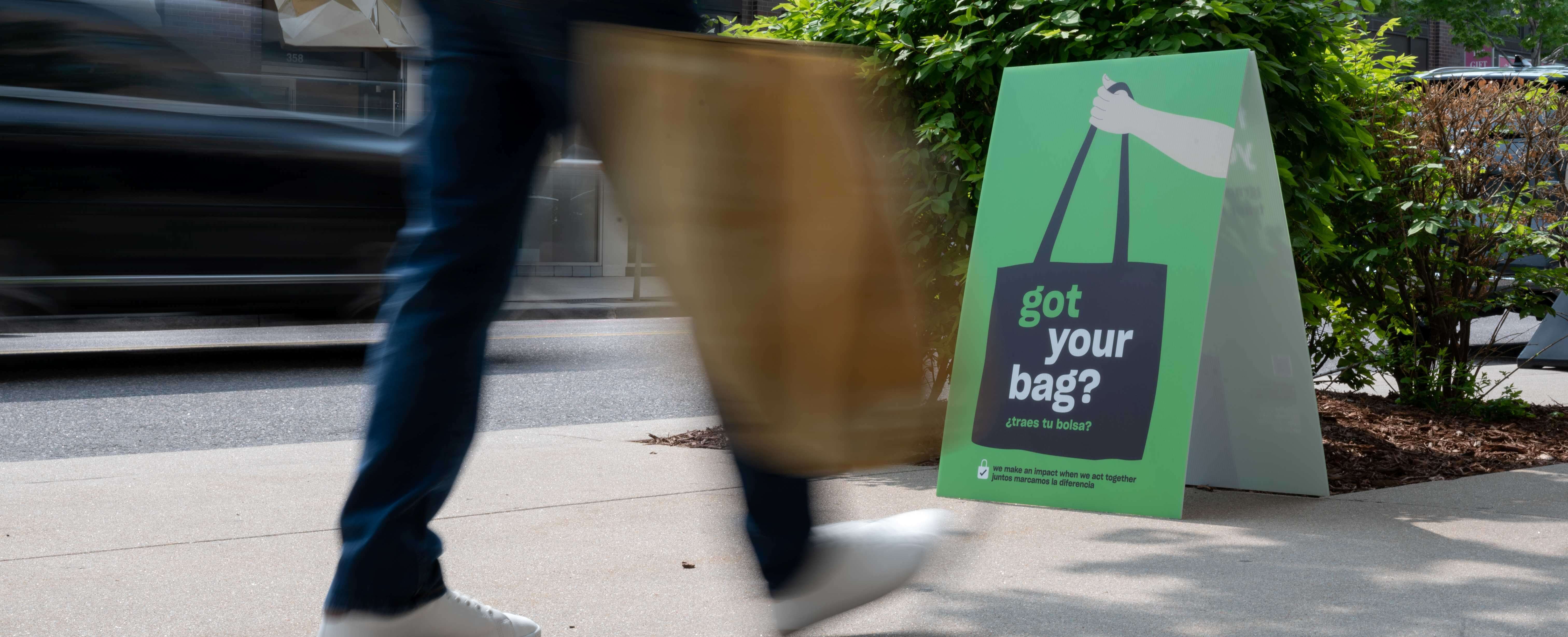 Person walking carrying a bag