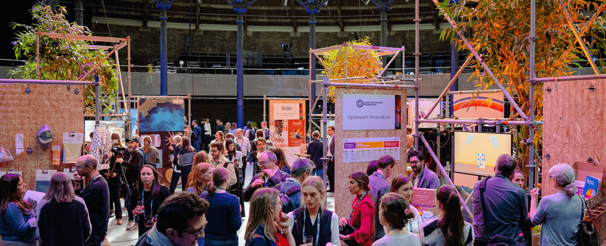 Network members walking around a circular economy exhibit