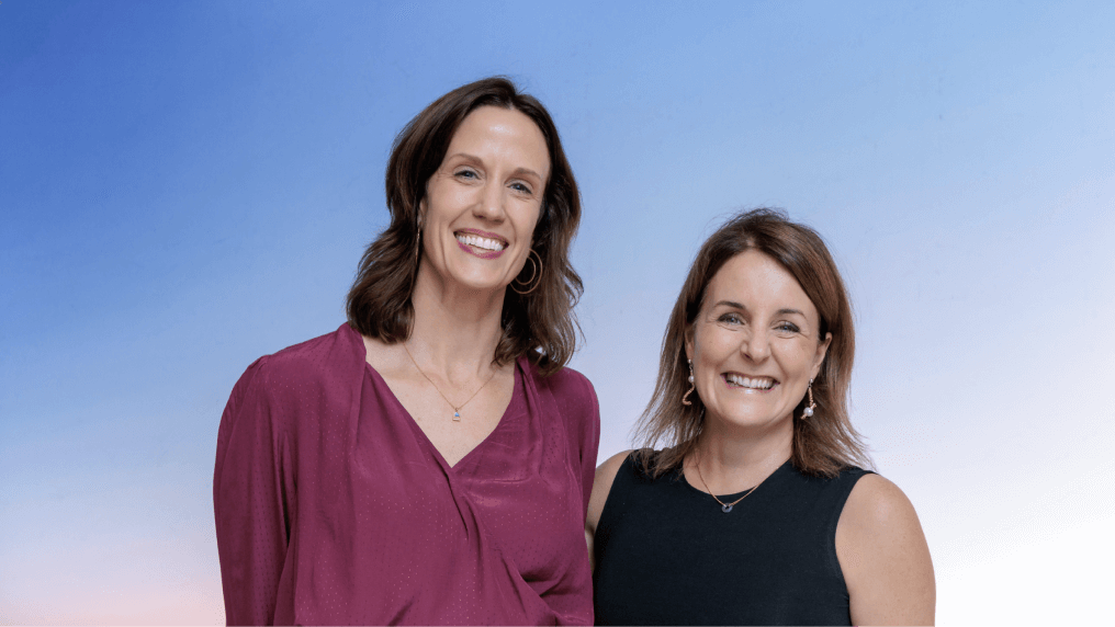 two people standing next to each other