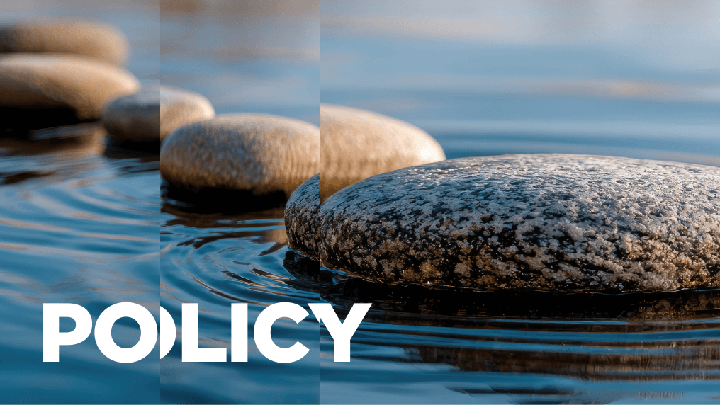 Rounded stones in water causing water ripples