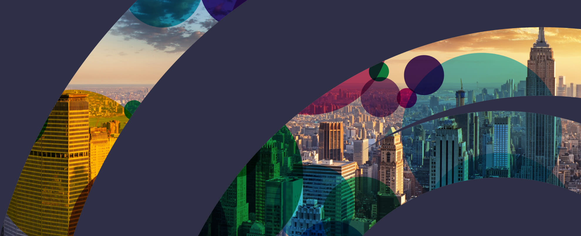 The cover image for the US Newsletter. It features a vast range of different buildings in an sunset setting.