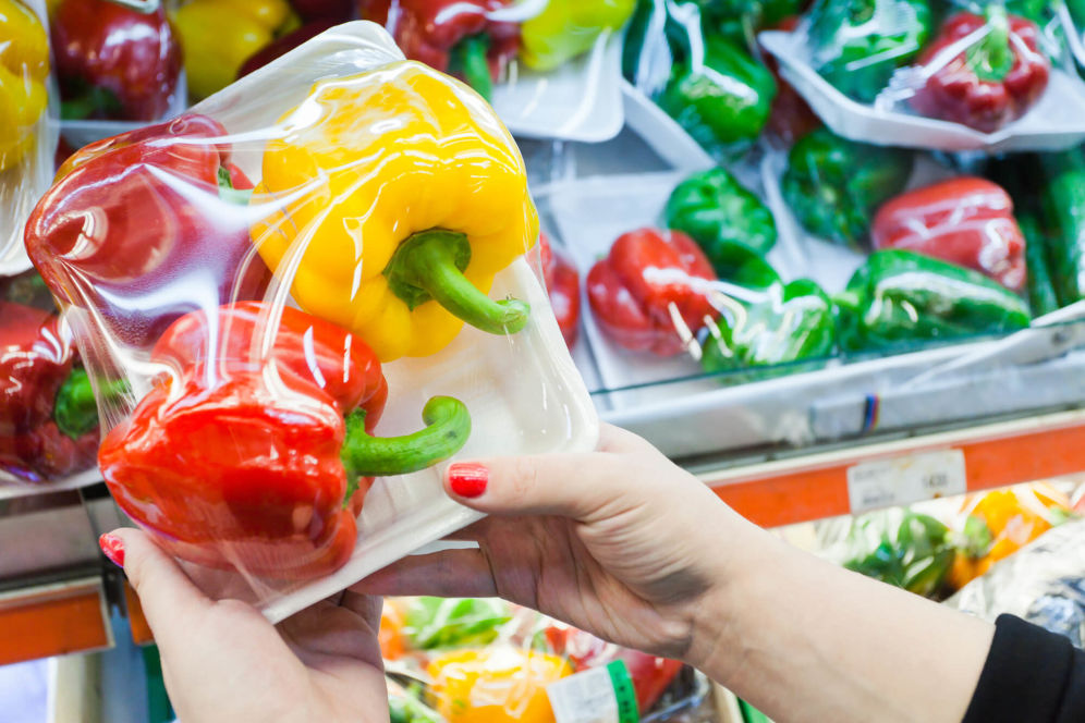 Person holding peppers