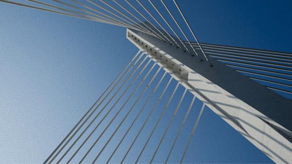 Looking up at the top of a bridge
