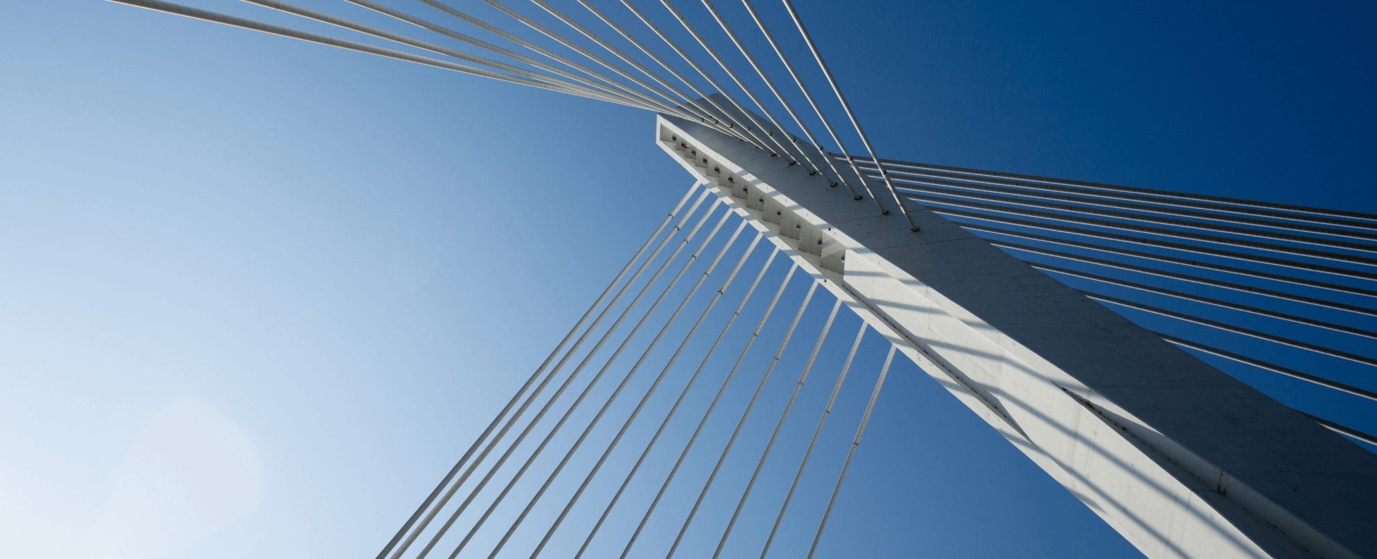 Looking up at the top of a bridge