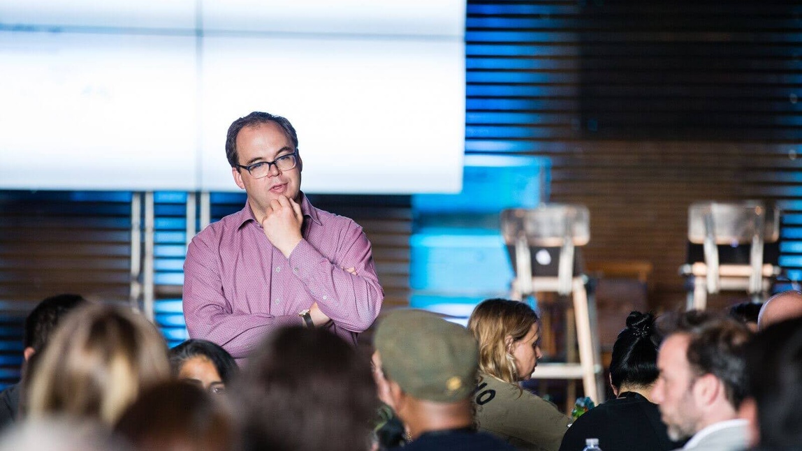 person stood in front of a crowd