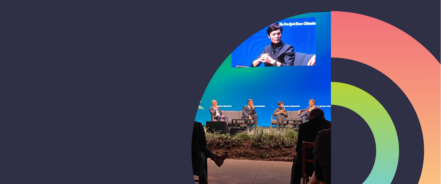 Photo of hosts on stage with abstract circles