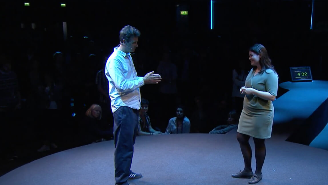 people talking on stage