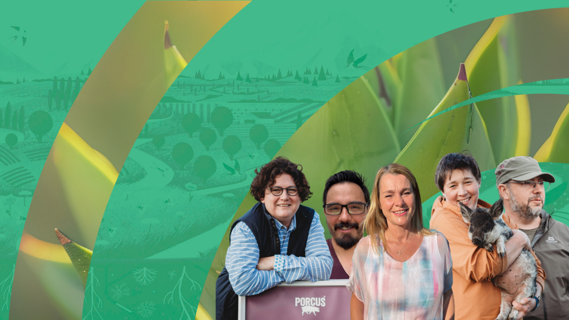 A group of people in front of a green banner. 