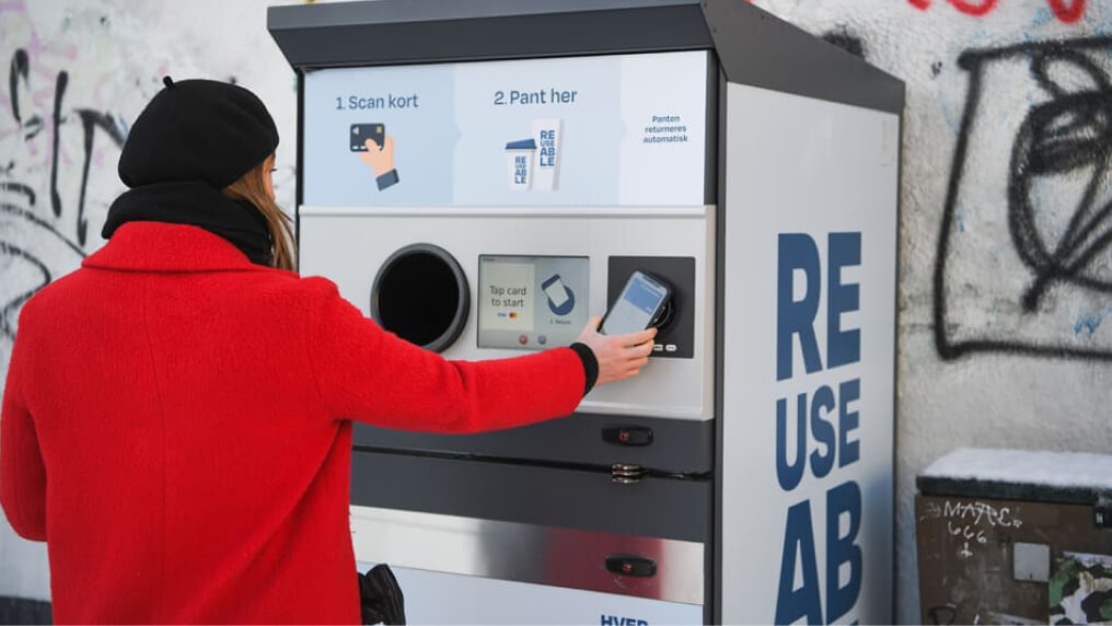 Image of someone using a card machine. 