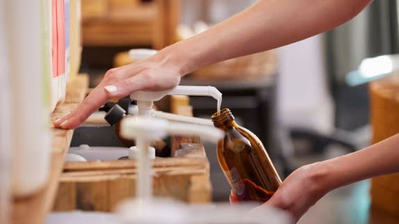 Picture of a person refilling a bottle