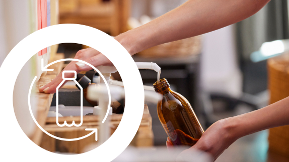 Plastic bottle icon on top of a picture of a person refilling a bottle