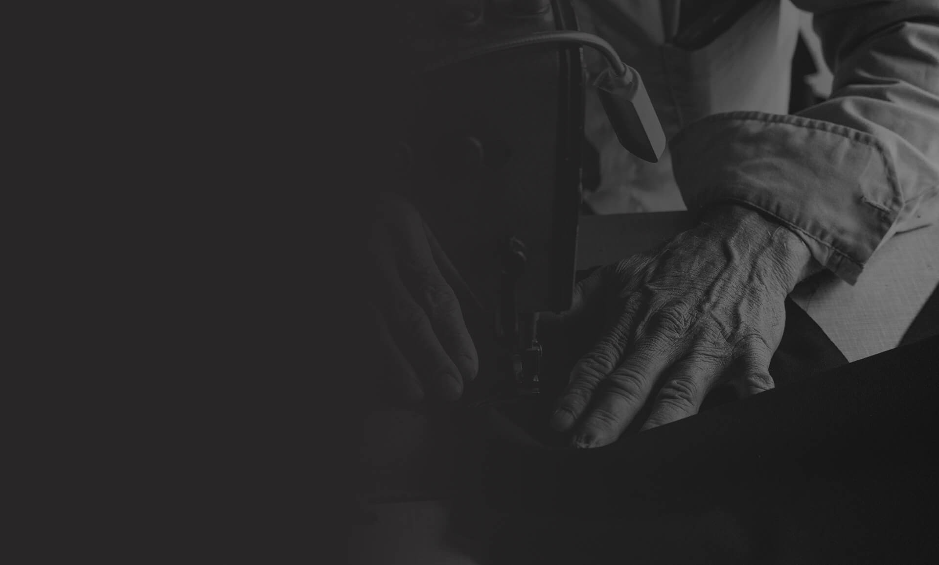 Person mending clothes on a sewing machine