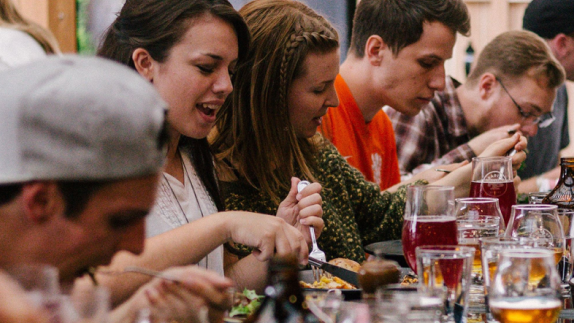 Group of people eating in a restaurant