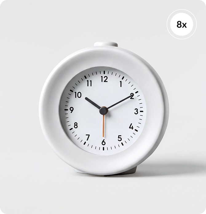 A white Mudita Bell 2 alarm clock