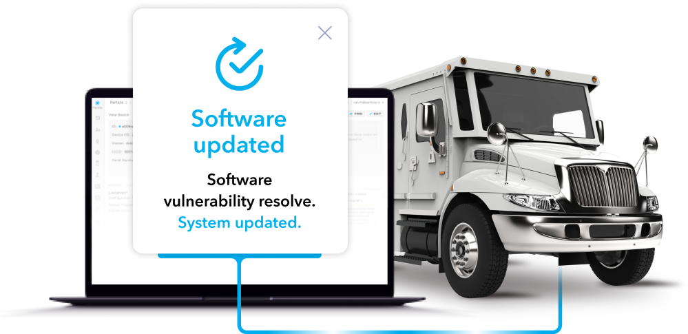 A laptop sending a secure OTA software update to a truck to fix resolve security vulnerabilities